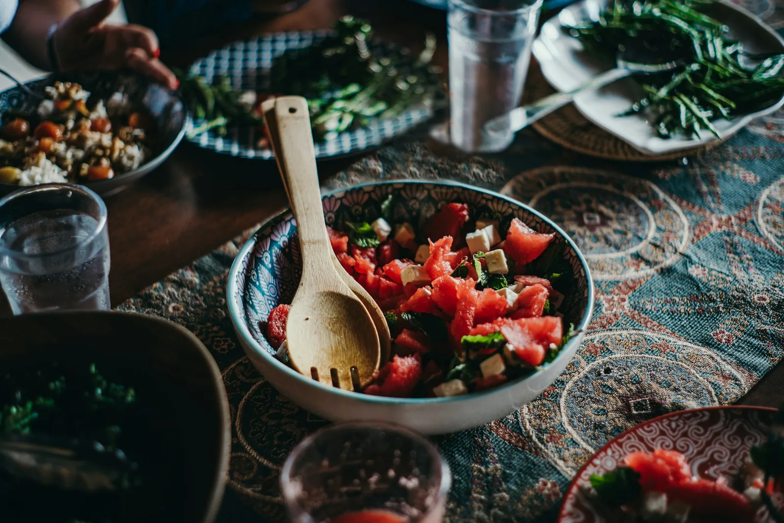 Salad bowls spread across a table