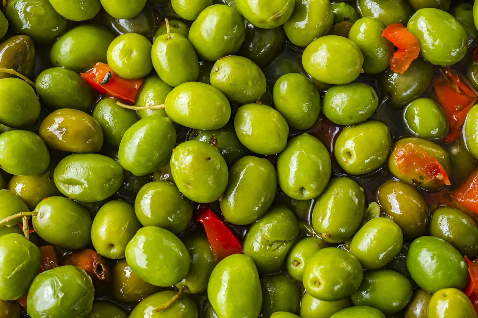 Olives and peppers in a jar