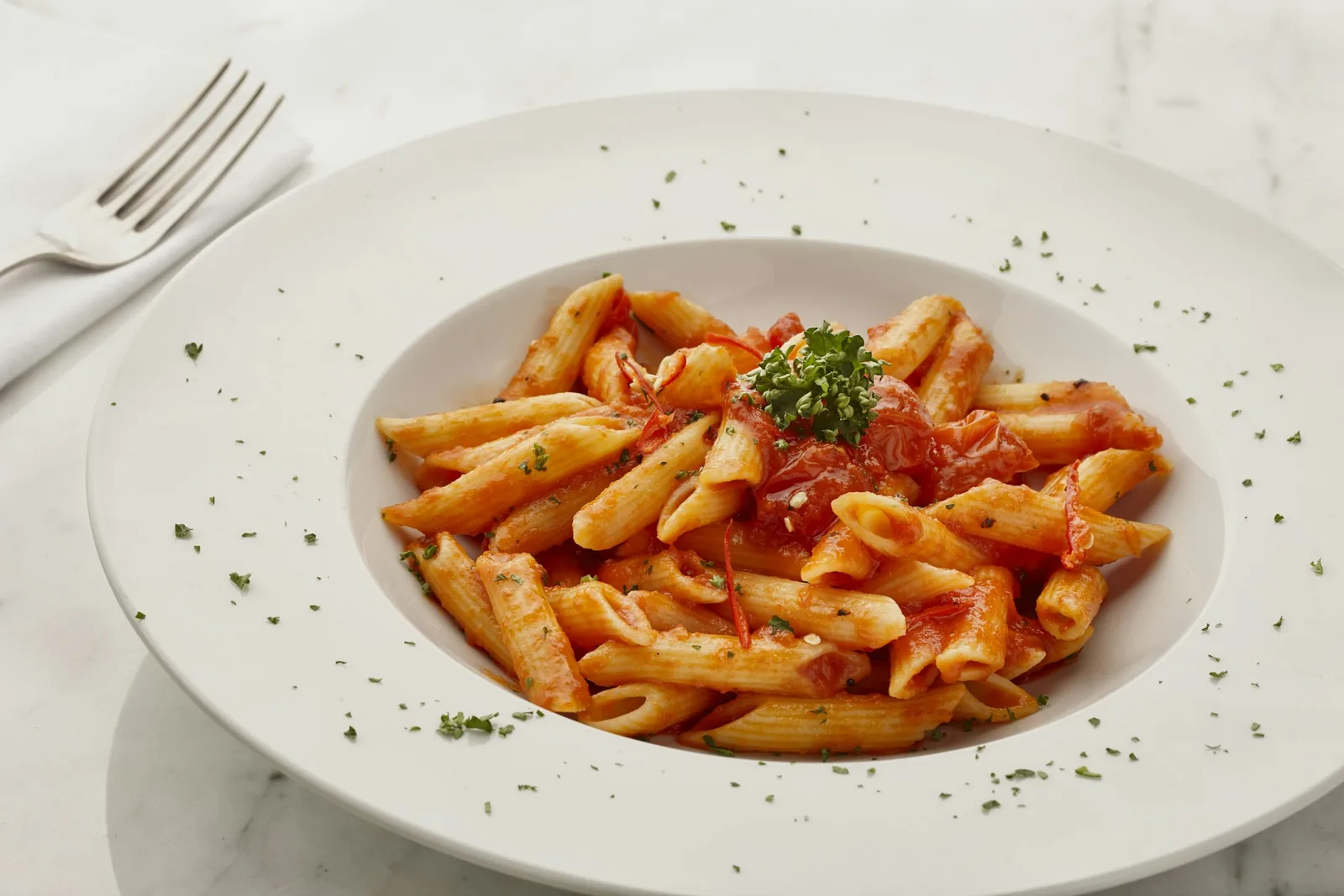 Pasta coated in sauce