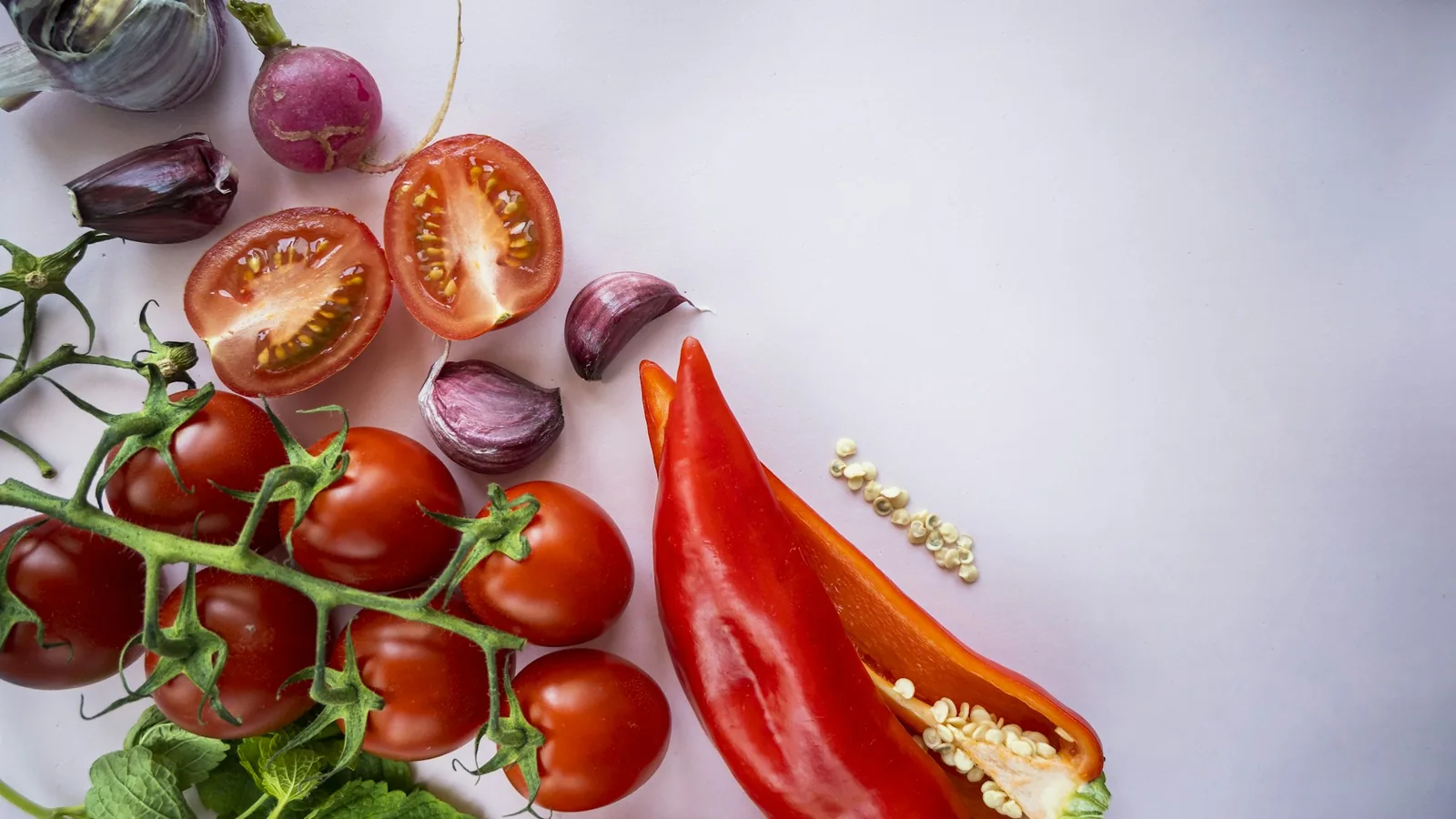 Tomatoes, garlic and herbs laid out