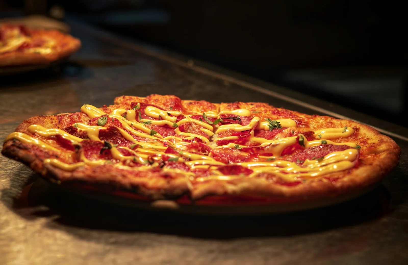 A pizza in warm light