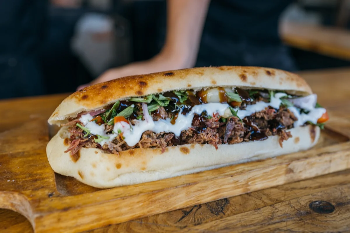 A cheese steak sub on a long roll