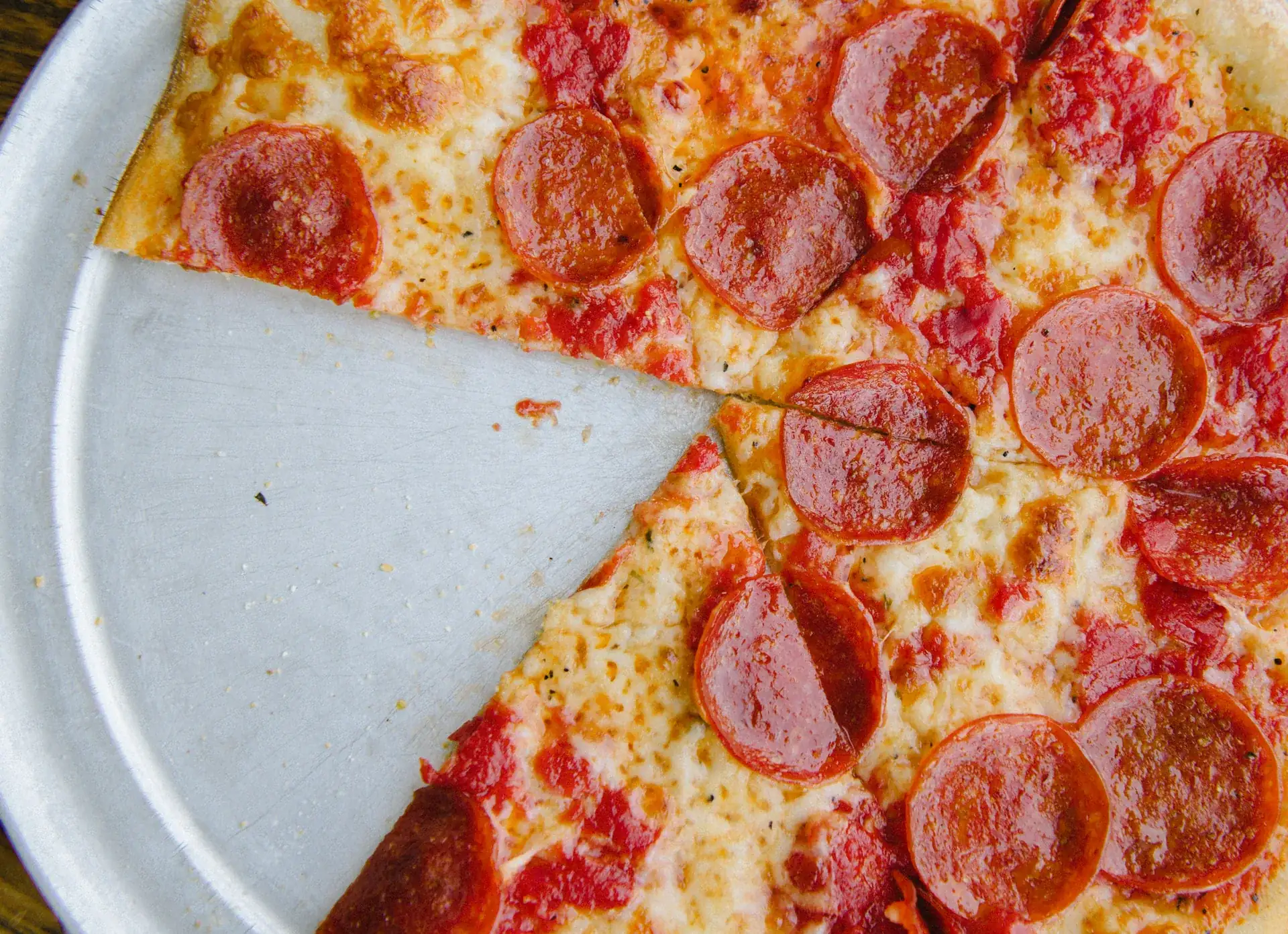 Pepperoni pizza with one slice removed