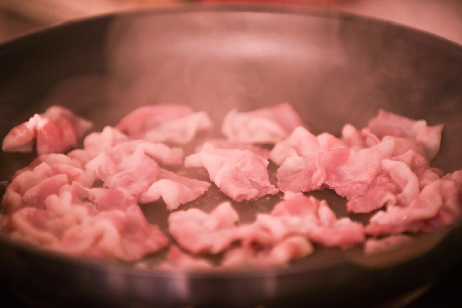 Meat cooking in a pan