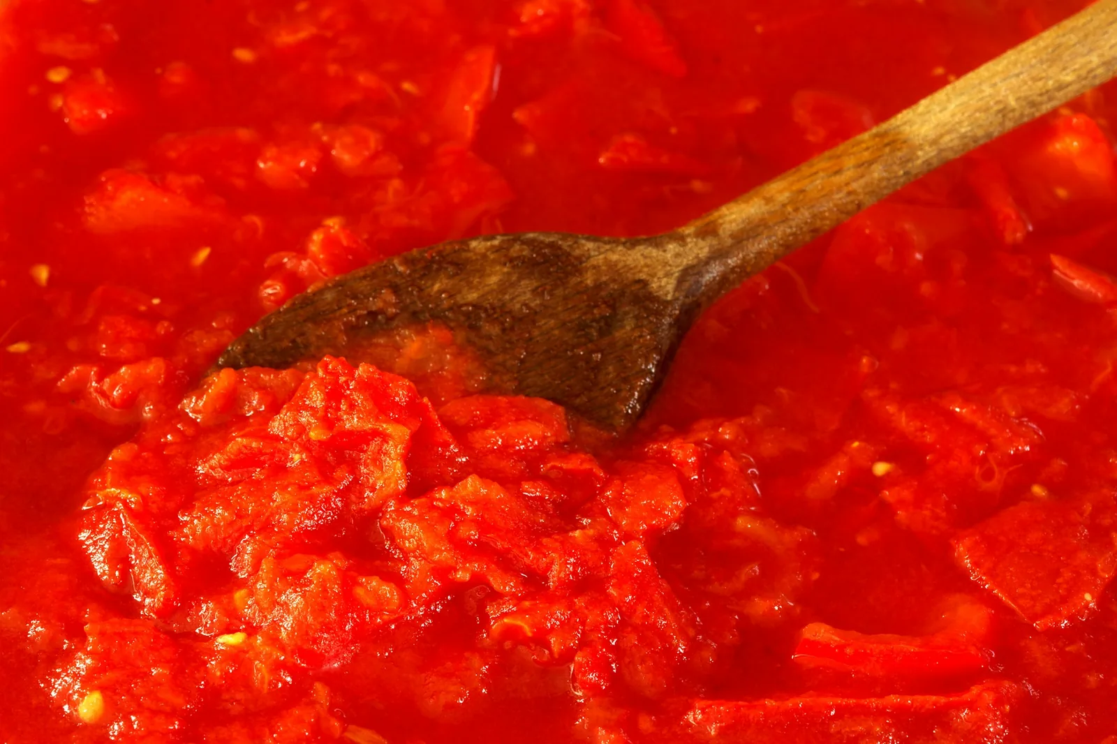 Tomato sauce simmering in a pan