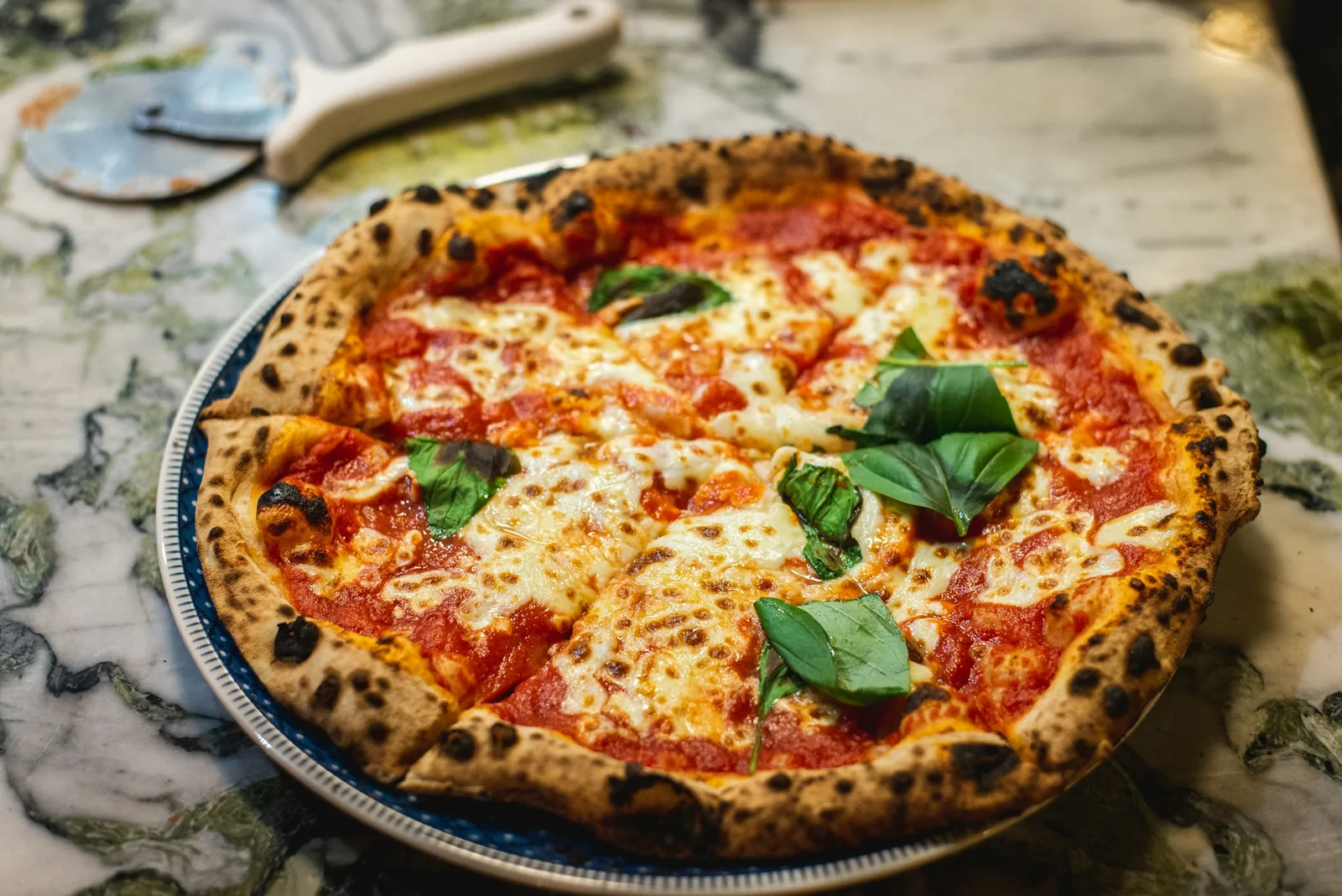 The charred edge of a Neapolitan crust
