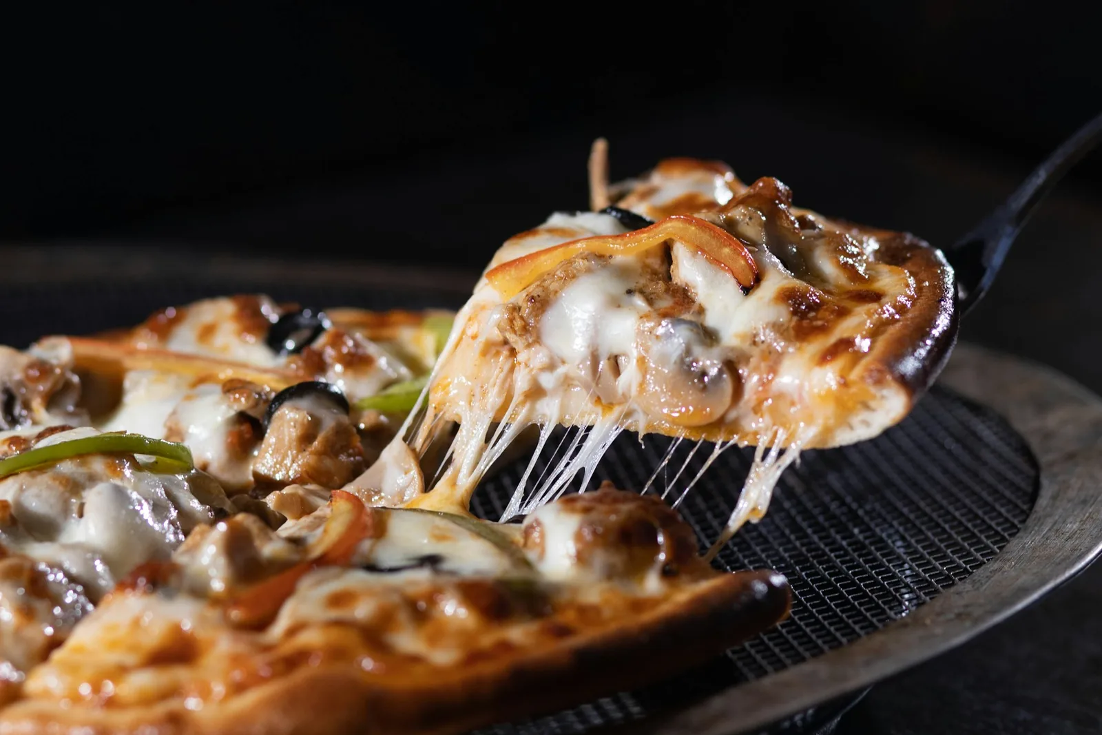 A thick, deep-dish pizza slice