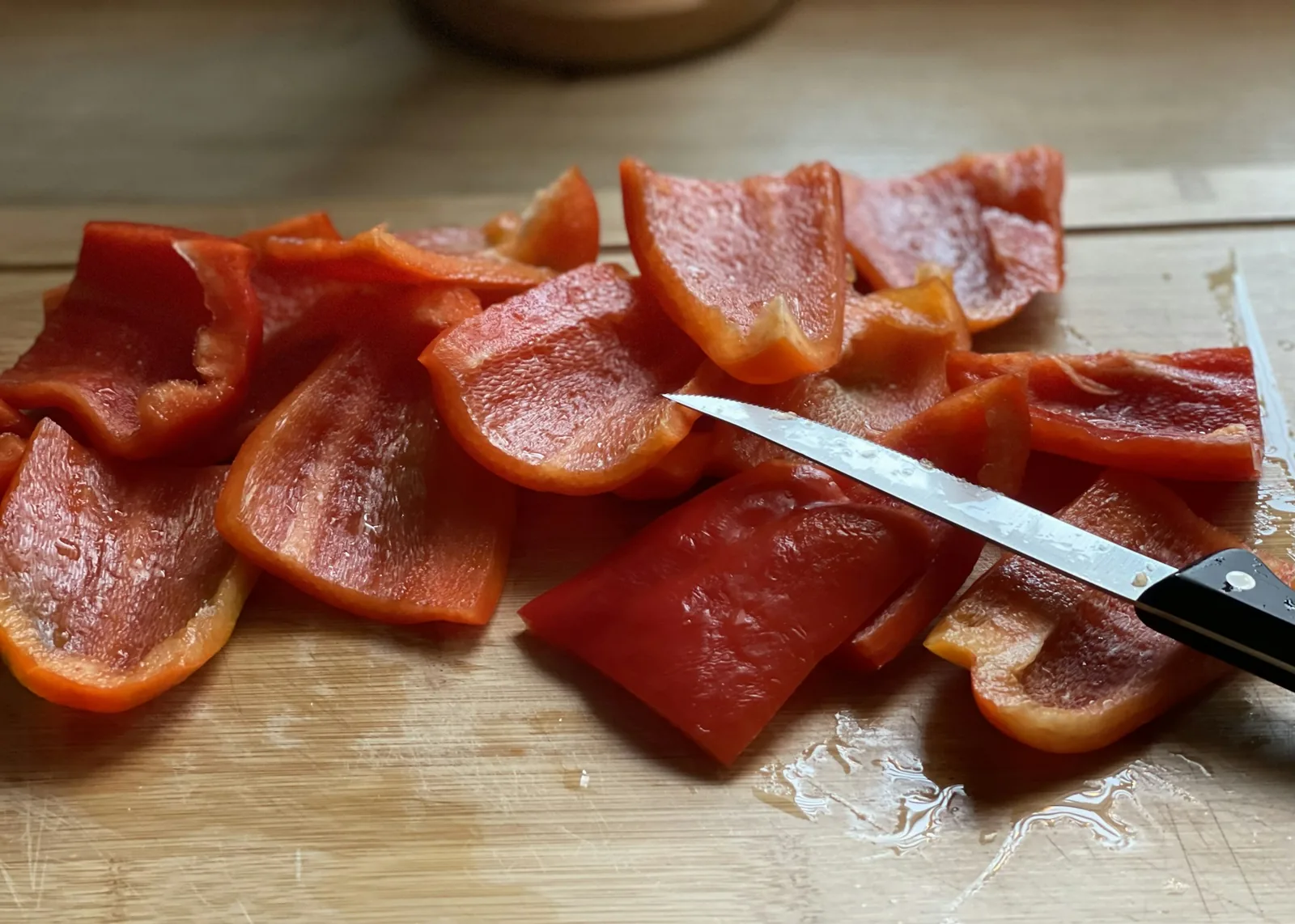 Red peppers being sliced