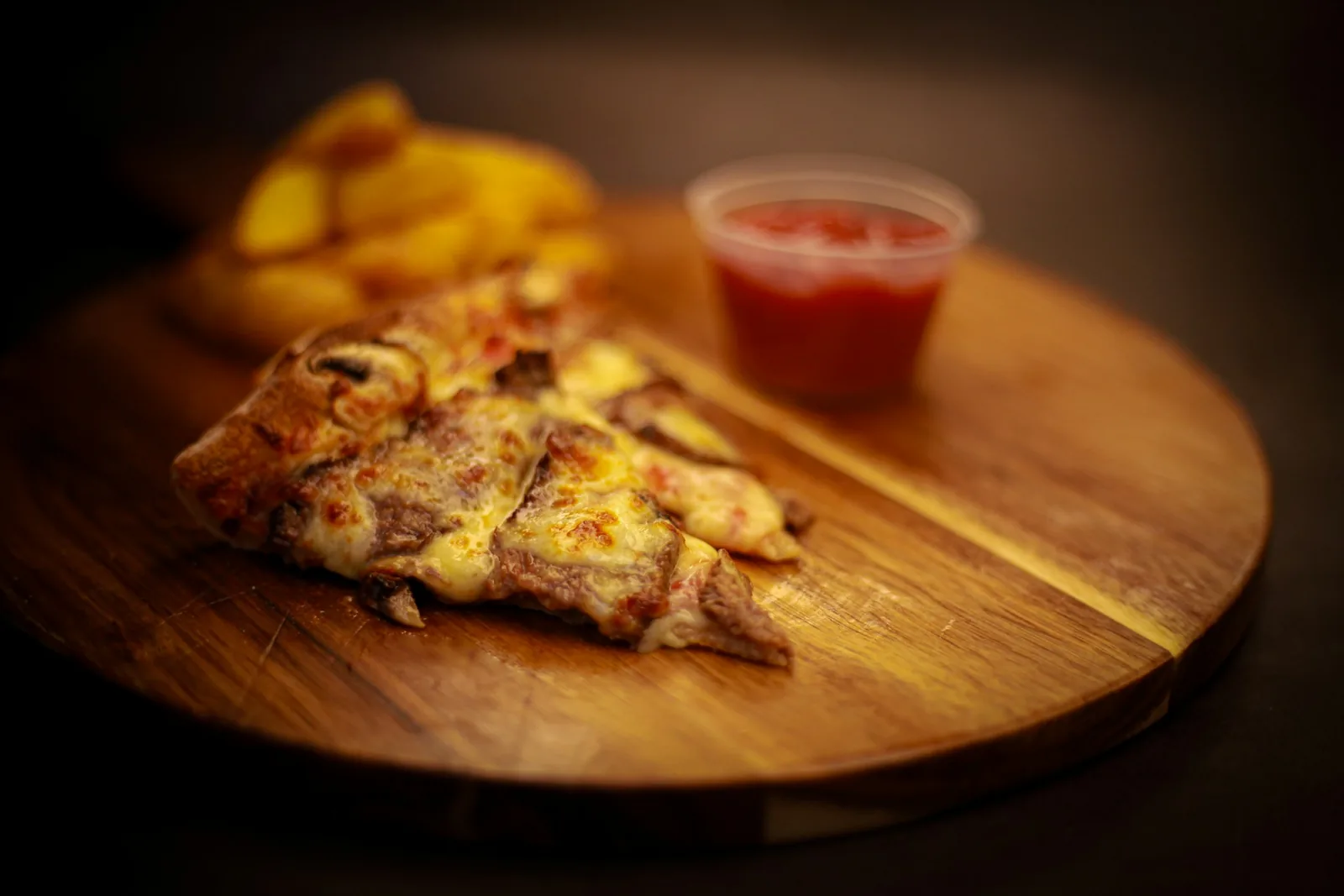 Pizza slices on a wooden board