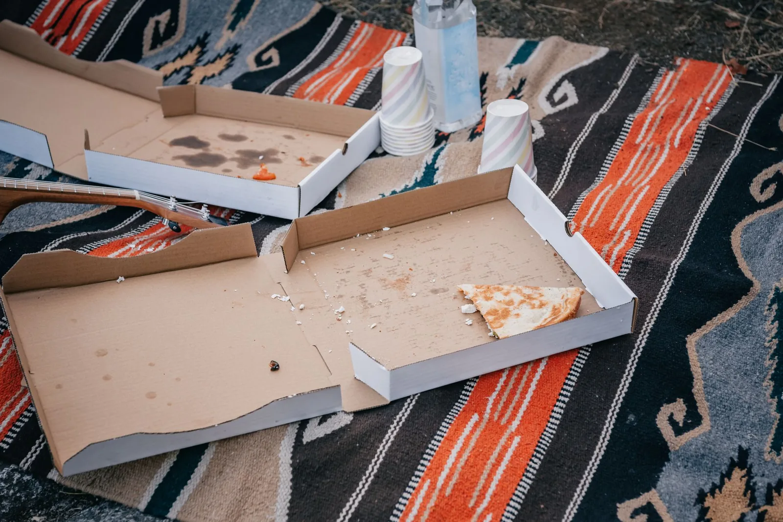 Leftover pizza in an open box