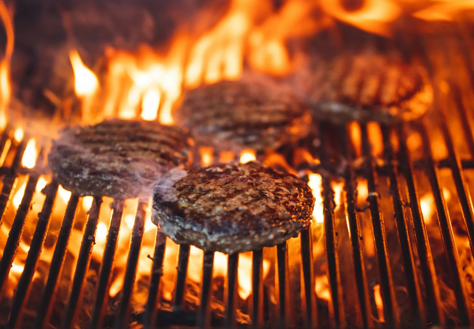 A patty cooking on a hot surface