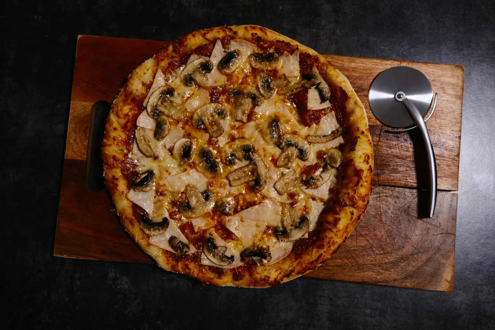 A simple pizza on a wooden board