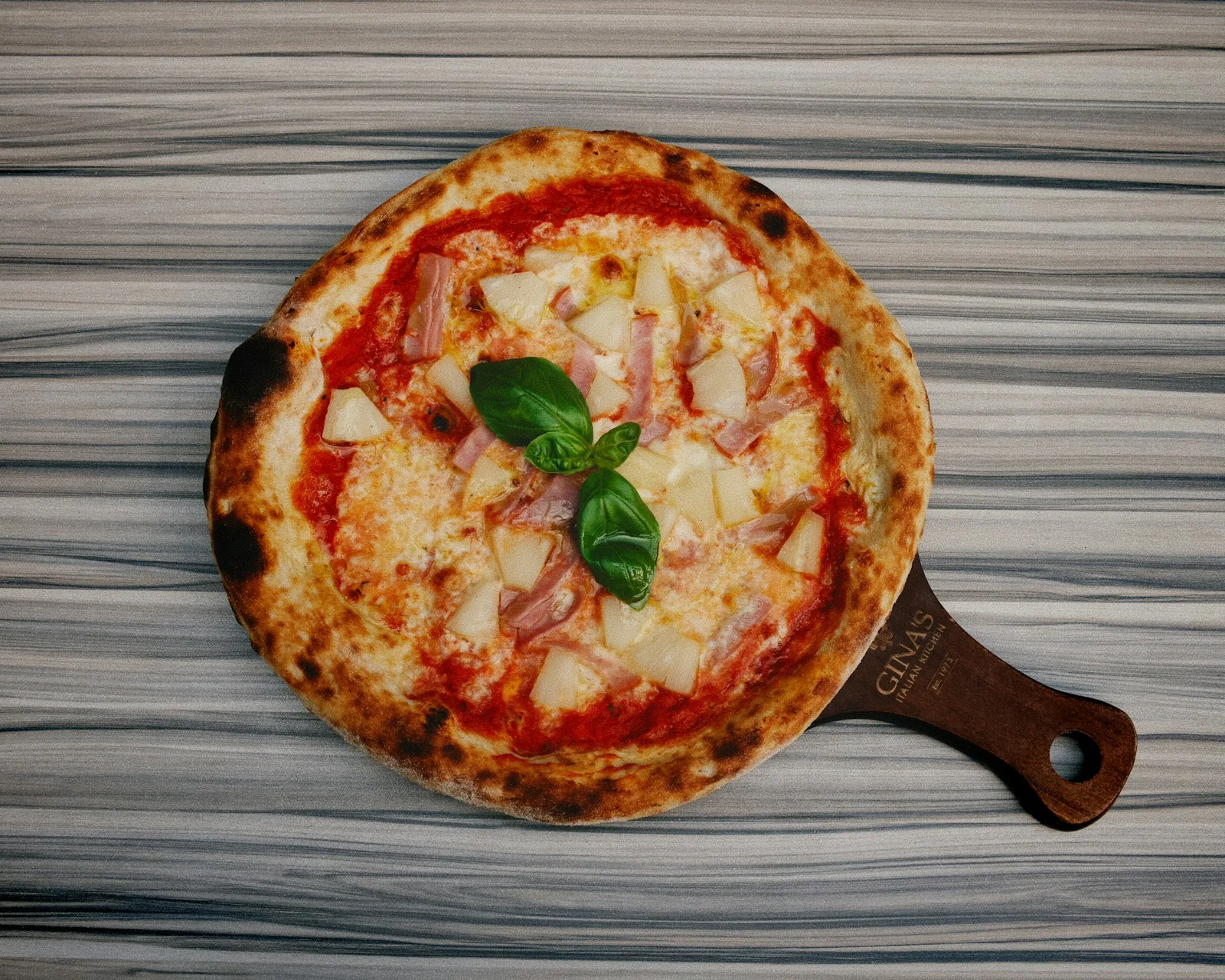 A round pizza in warm light