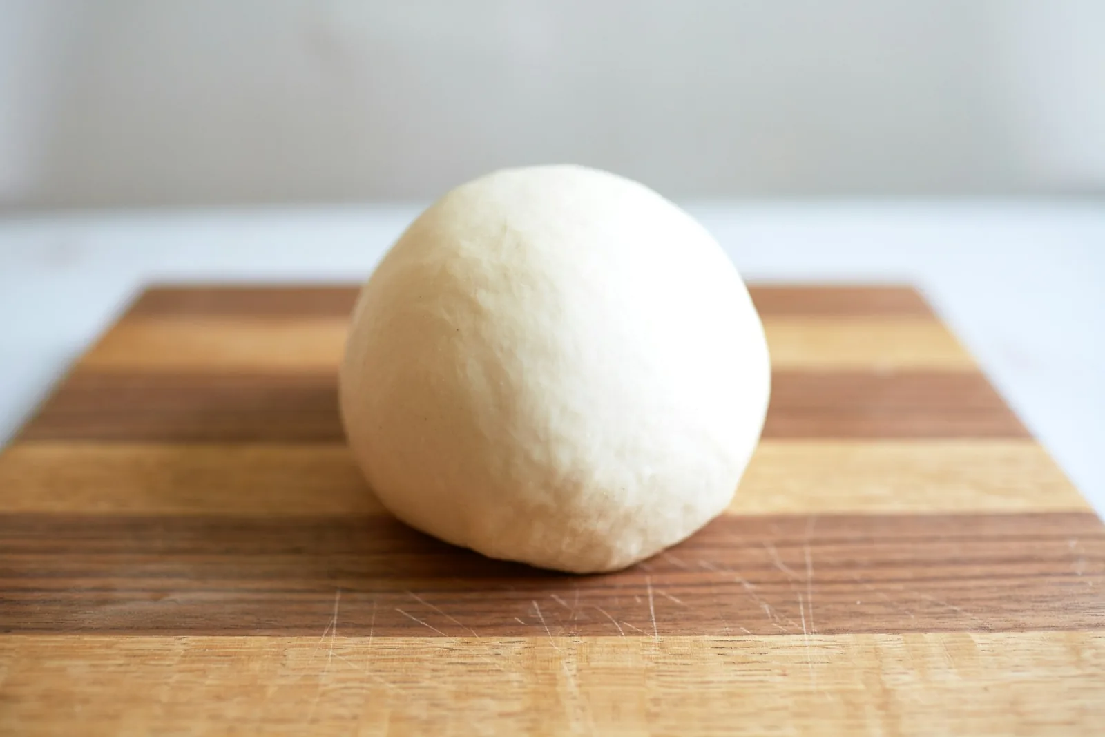 A round ball of pizza dough